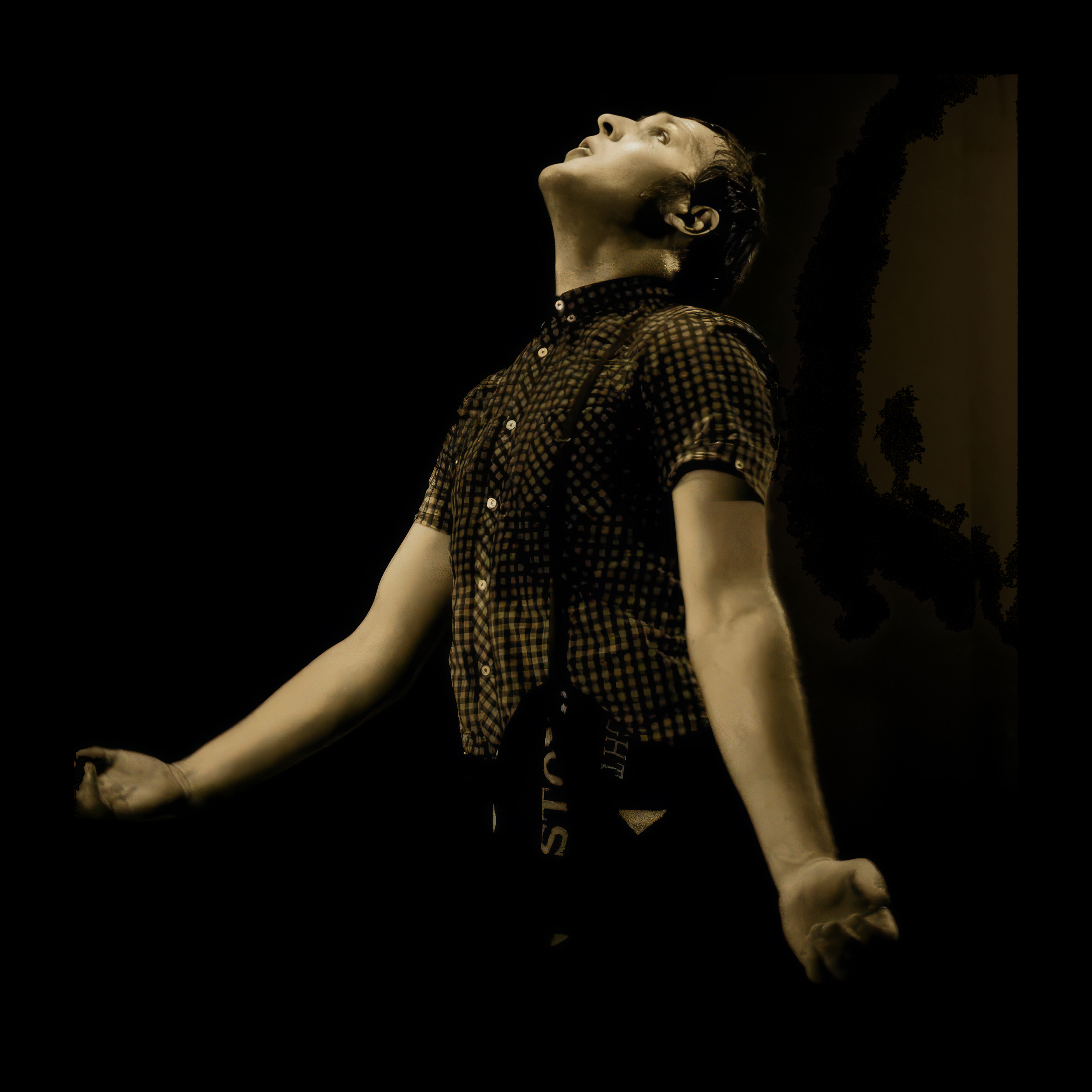 A Northern Soul dancer leaning back with arms outstretched.
